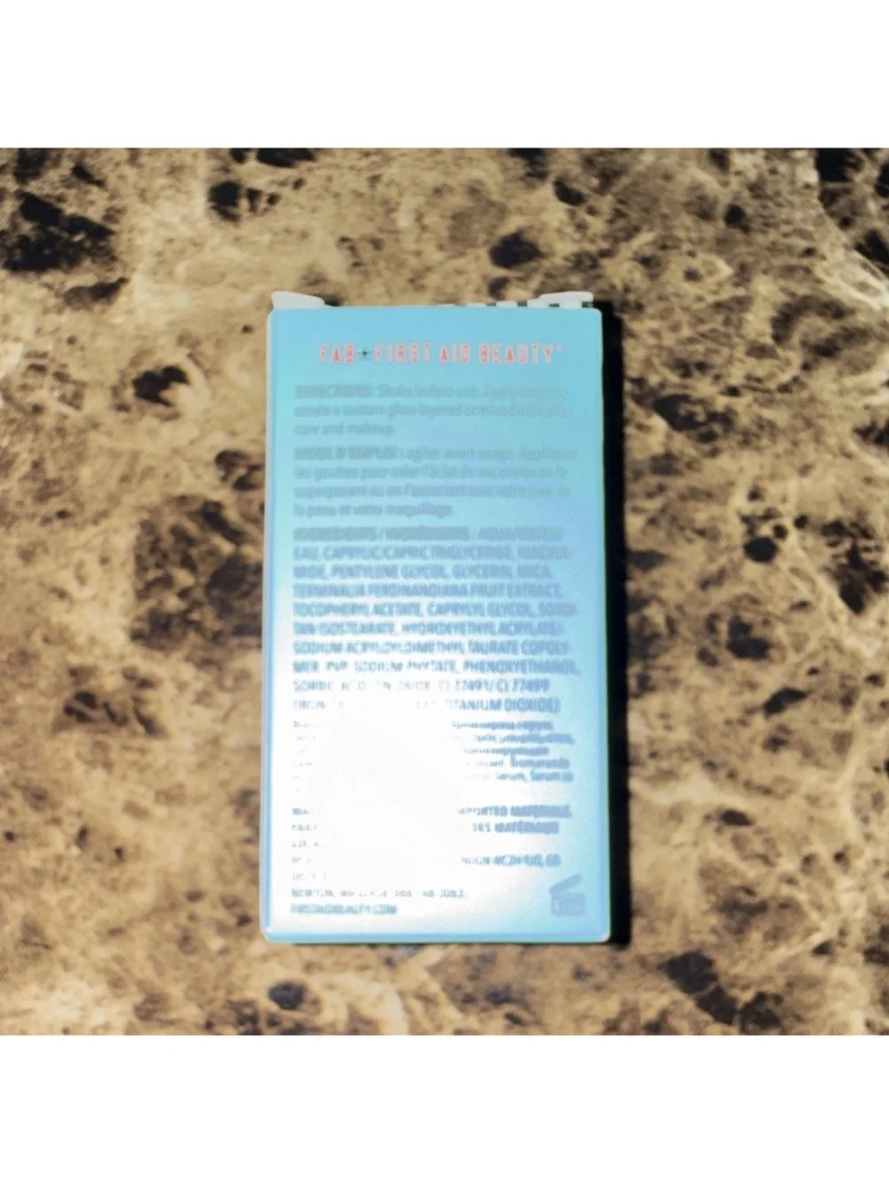 First Aid Beauty Bronze + Glow Drops Aqua and White Packaging